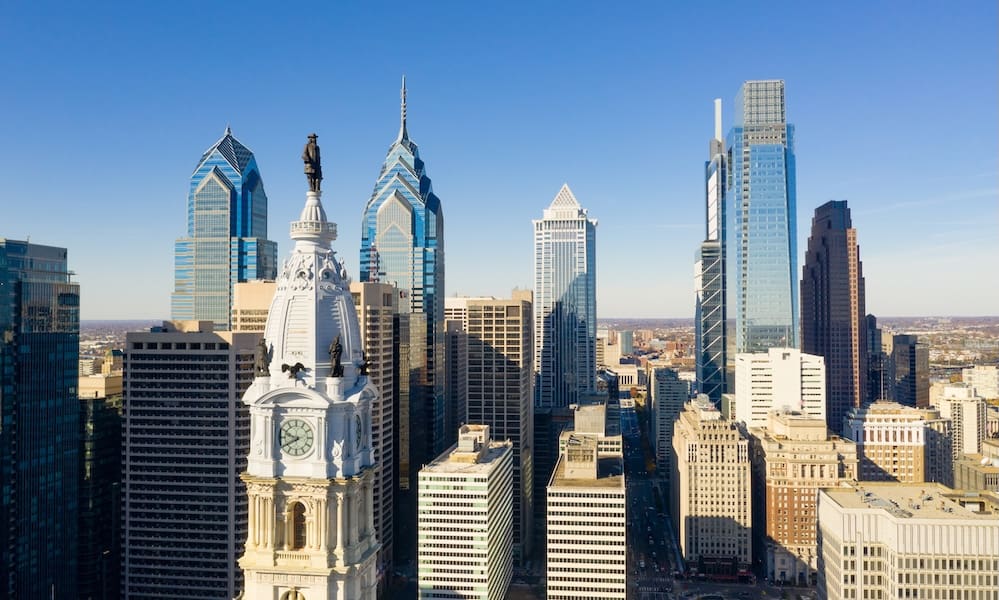 Statue of Ben Franklin looks over the city streets of Philadelphia PA